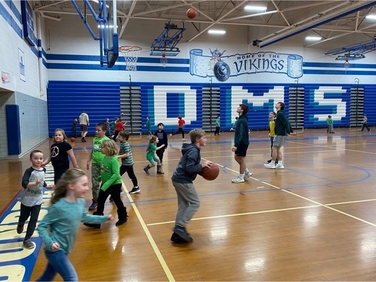 Students playing on a basketball court